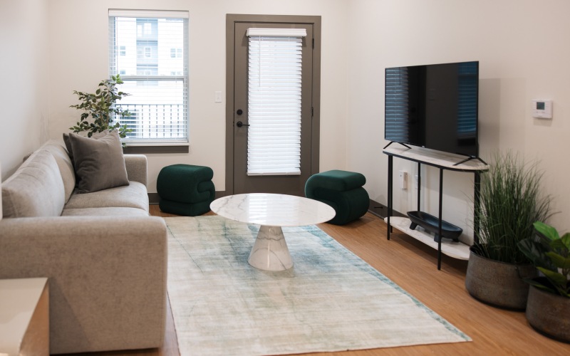 living room with a couch coffee table and tv